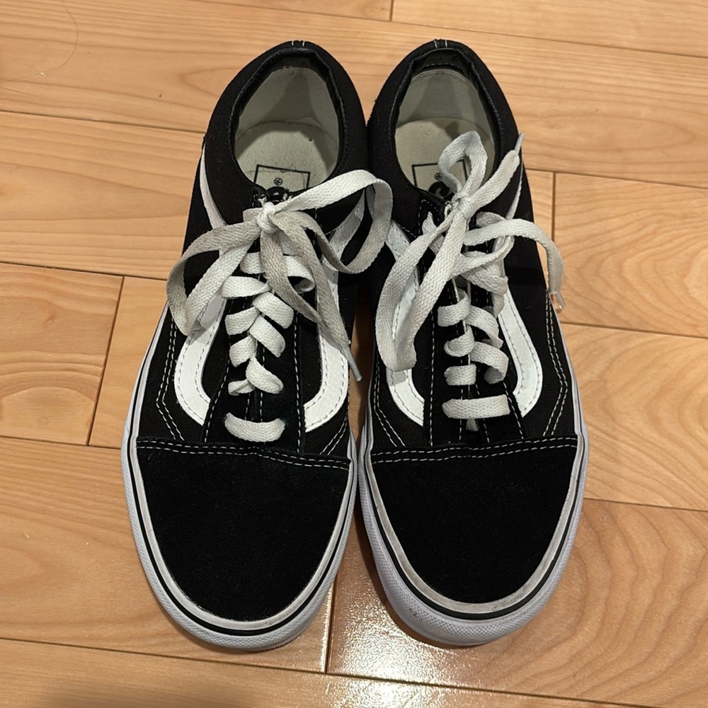 Black and white Vans sneakers- gently worn. Men’s size 5 and women’s size 6.5
